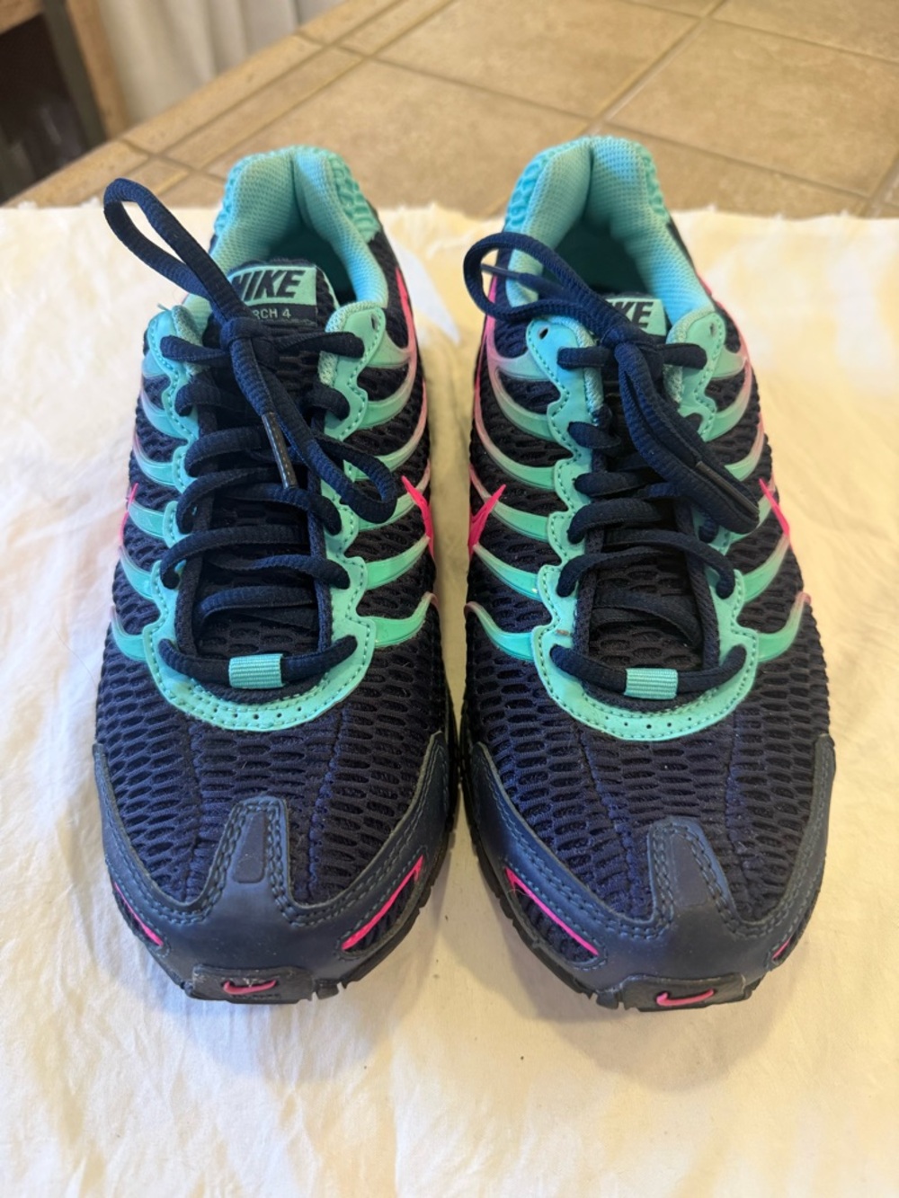Nike Torch 4 Sneakers in Navy, Teal & Pink